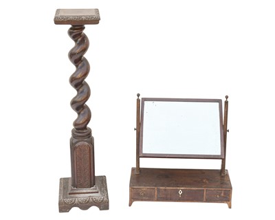 Lot 877 - A 17th century style walnut torchere.