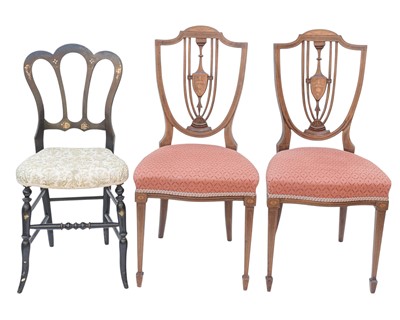 Lot 876 - A pair of Edwardian mahogany and inlaid shield back chairs.