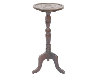 Lot 799 - A George III style oak candle stand.