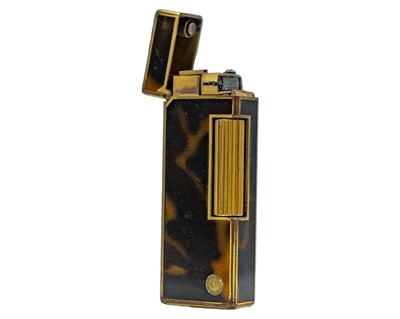 Lot 215 - A Dunhill gold-plated tortoiseshell effect lighter.