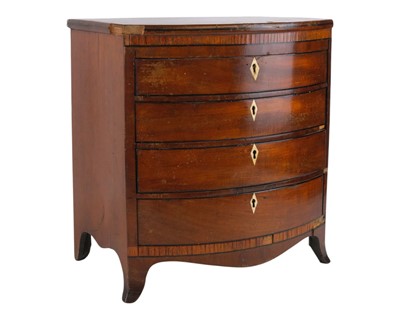 Lot 86 - A mahogany bow front miniature or apprentice chest.