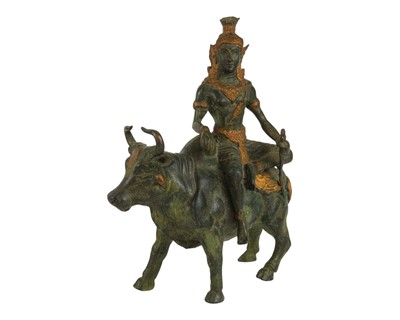 Lot 501 - An Indian bronze figure of Shiva sitting on a bull.