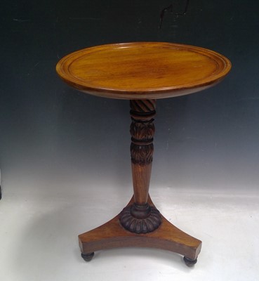 Lot 25 - A mahogany topped wine table on a Regency...