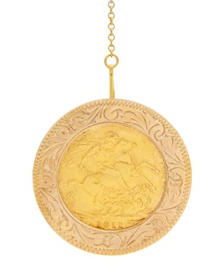 Lot 127 - A George V full sovereign gold coin in a 9k hallmarked brooch.