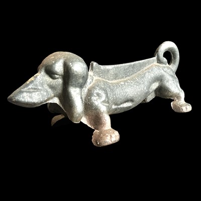 Lot 31 - A cast iron boot scraper in the form of a...
