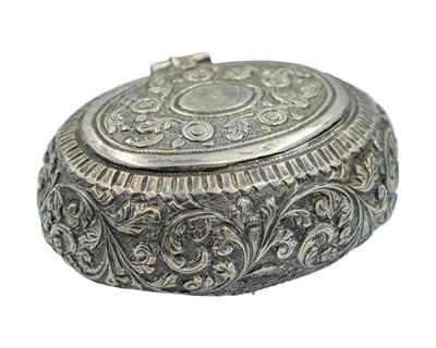 Lot 170 - A Southeast Asian white metal repoussé trinket box.
