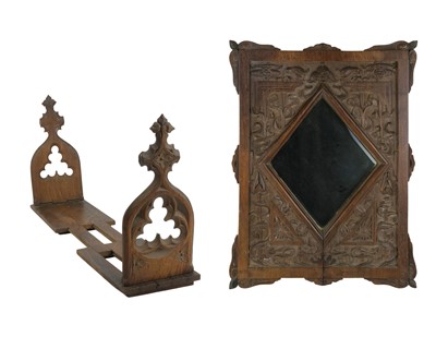 Lot 101 - A Victorian Gothic oak sliding adjustable book rack.