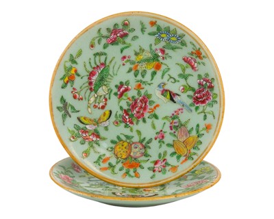 Lot 556 - Two Canton famille rose celadon ground plates, circa 1900.