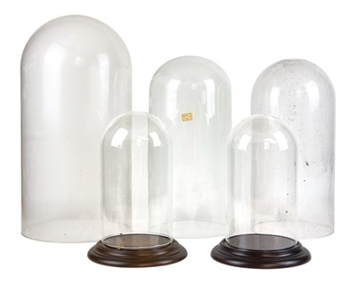 Lot 73 - Five assorted glass display domes