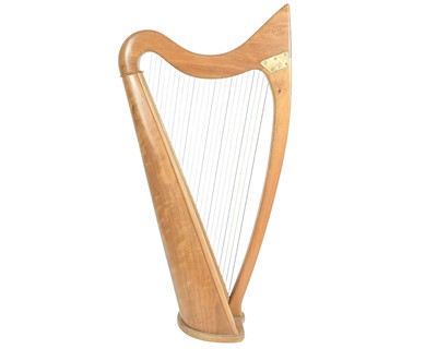Lot 430 - A walnut 24 strng Celtic harp.