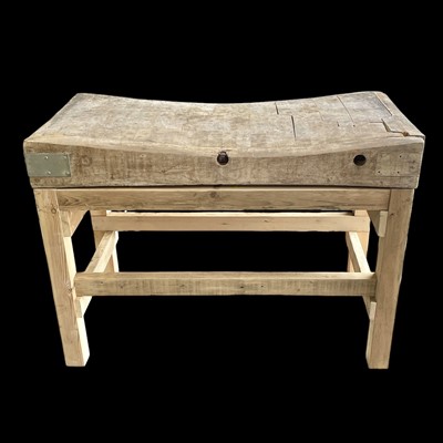 Lot 22 - A heavy vintage butcher's block on a later...