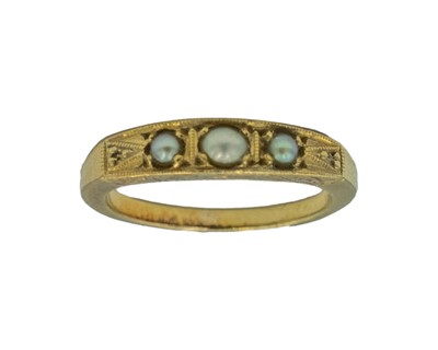 Lot 93 - A Victorian Etruscan Revival high-purity gold split pearl set three-stone ring.