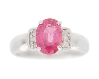 Lot 139 - An attractive modern 18k white gold oval cut pink topaz and diamond set ring.