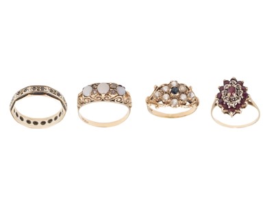 Lot 150 - A selection of four 9k gem-set rings.