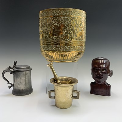 Lot 54 - An Indian brass jardiniere, embossed with a...