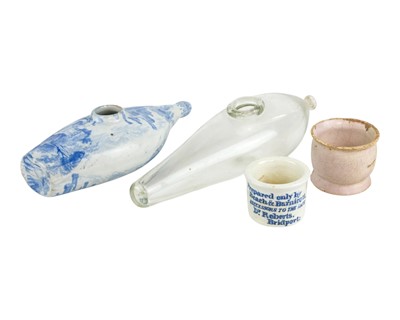 Lot 461 - A blue and white pottery baby feeder.