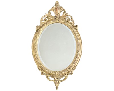 Lot 793 - A carved giltwood and gesso oval wall mirror.