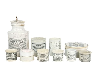 Lot 464 - A collection of transfer printed ointment pots and jars.