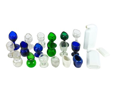 Lot 455 - A collection of clear and coloured glass eye baths.