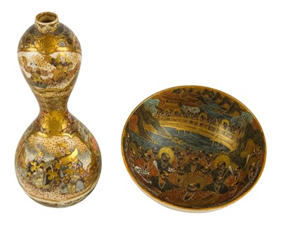 Lot 522 - A Japanese Satsuma double gourd shape vase with figural panels.