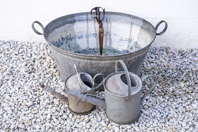 Lot 762 - A galvanised metal watering can bearing plaque 'Sissinghurst'.