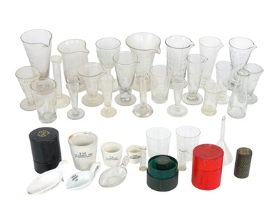 Lot 448 - A collection of glass and earthenware measures and flasks.