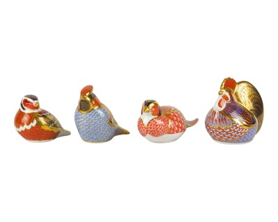 Lot 686 - Four Royal Crown Derby bird paperweights.