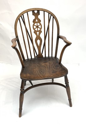 Lot 3097 - An elm Windsor armchair, 20th century, with...