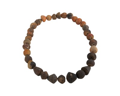 Lot 20 - A collection of 33 Mali (West Africa) terracotta spindle whorls.