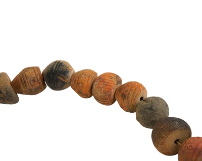 Lot 20 - A collection of 33 Mali (West Africa) terracotta spindle whorls.
