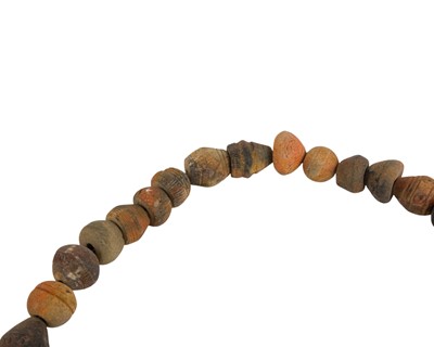 Lot 20 - A collection of 33 Mali (West Africa) terracotta spindle whorls.