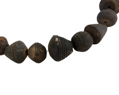 Lot 20 - A collection of 33 Mali (West Africa) terracotta spindle whorls.