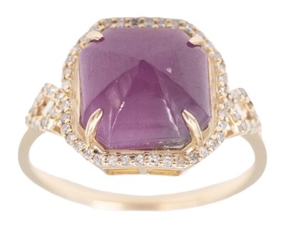 Lot 143 - A 9k yellow gold octagon cabochon ruby and diamond set dress ring.