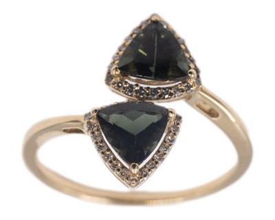 Lot 159 - A 9k yellow gold 1.38ct trillion-cut tourmaline and diamond set crossover ring.
