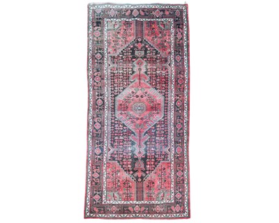 Lot 562 - A Persian wool carpet.