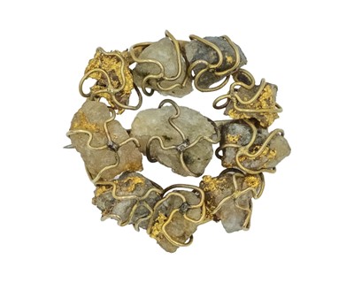 Lot 140 - A 19th-century gold prospector's brooch, with natural gold in quartz matrix on a gold frame.