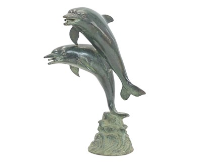 Lot 8 - A small bronze fountain head modelled as two leaping dolphins.