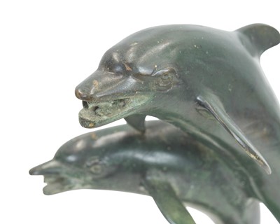 Lot 8 - A small bronze fountain head modelled as two leaping dolphins.