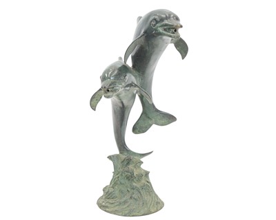 Lot 8 - A small bronze fountain head modelled as two leaping dolphins.