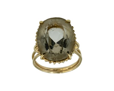 Lot 163 - An oval cut citrine cocktail ring, set in yellow gold.