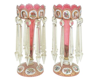 Lot 687 - A pair of cranberry glass lustre vases.
