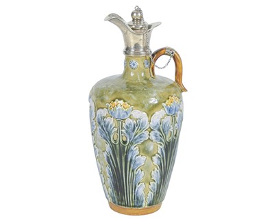 Lot 711 - A Doulton Lambeth silver mounted stoneware ewer.