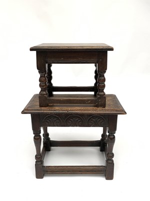 Lot 3036 - A carved dark oak joint stool and a similar...