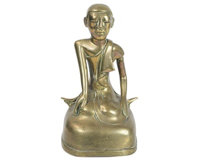 Lot 500 - A Burmese bronze figure of a seated monk or disciple.