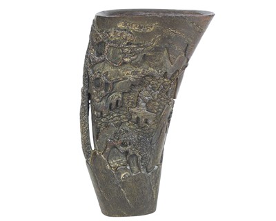 Lot 545 - A Chinese carved buffalo horn libation cup.