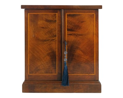 Lot 98 - A Victorian figured walnut table top collector's cabinet.