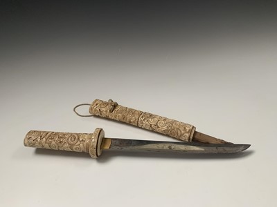 Lot 117 - A Japanese ivory tanto, Meiji Period, the...