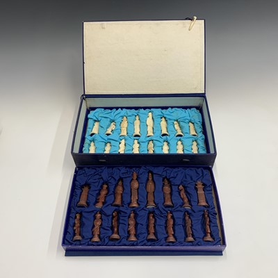 Lot 257 - A Chinese bone and red stained composition...