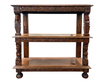 Lot 795 - A late Victorian carved oak three-tier buffet.