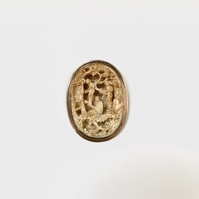 Lot 184 - A Chinese Canton carved ivory oval brooch,...